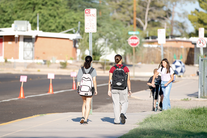 Students walk across the street to school